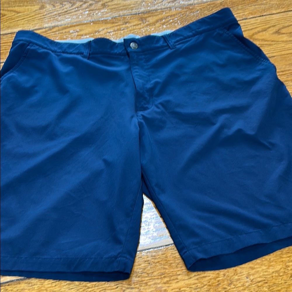 Adidas navy blue golf shorts. Flat front. Size 40.  Excellent condition.